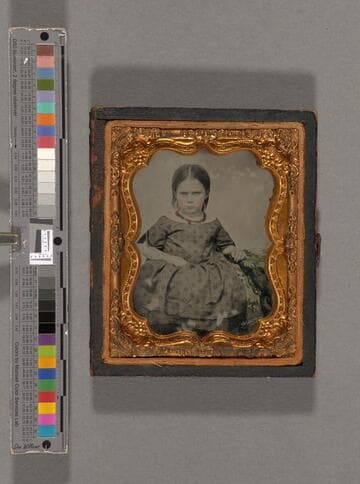Portrait of a little girl with scowl [Mitchell family?]