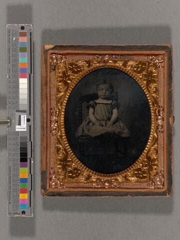 Mary A. (Worthington) McCloskey as a little girl, seated in chair