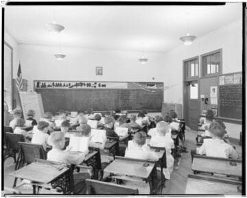 L1.7 - Lighting, schools/library - Classroom from rear with students reading