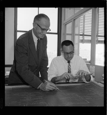 Men reviewing electrical plans
