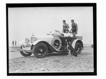 Jack Donovan and lifeguards in car on beach with dogs, Santa Monica, California