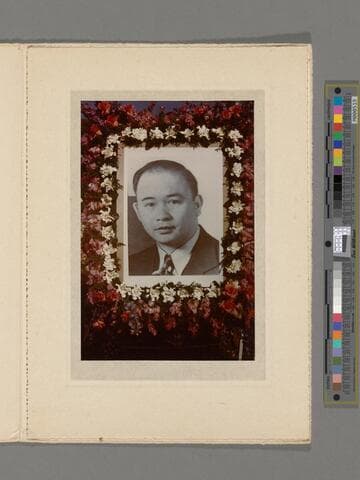 Photograph of the portrait of Peter SooHoo surrounded by flowers used in his funeral