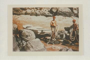 Nevills and Frost pose with the lines after lining a sadiron down Vulcan Rapid.  The sadiron is pulled up on the rocks for reloading