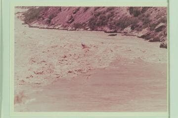 With no crew aboard, the "Bootoo" hits the heaviest waves in Vulcan Rapid.  A second after this photo was made, the craft capsized