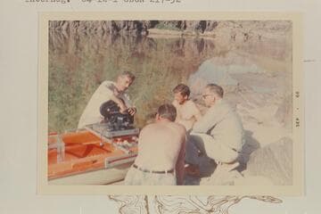 Jake rigs a camera on a Sportyak for run of 217 Mile Rapid.  Bill Lindsley and Bill Wynn supervise