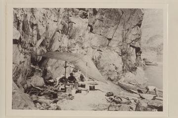 Camp at Shinumo Creek.  Dodge under fly.  Kolb in boat.  From 5x7 print in Lint album