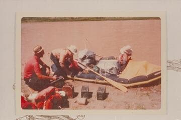 Bud Rusho and his two sons preparing their small inflated unit at Split Mountain for a cruise to Green River, Utah