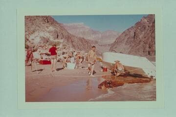 Repairs to "WEE RED" after Bill Austin piled onto the beach at Monument Creek Rapid