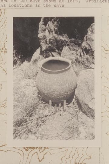 Olla and prehistoric cobs at mouth of Olla Vieja Cave on the slope of Osiris Temple where Donald Davis  found them 1966, May 31.  The entrance to the cave shows at left.  Artifacts were returned to original locations in the cave