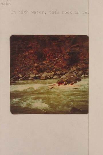 A. K. Reynolds passing the big rock at the lower end of Disaster Rapid.  In high water, this rock is covered