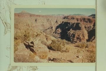 Cairn on Supai ledge on old horse trail which reached the river near Indian Creek.  The Trumbull Mountains are on the skyline