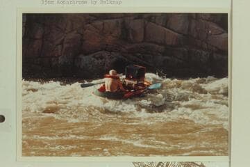 Dock Marston getting into the rough of 217 Mile Rapid in a Yak with 35mm camera mounted on it
