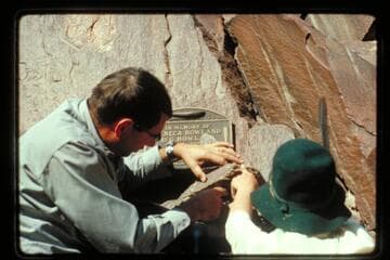 Jim Bailey and F. Strathairn fasten 1934 plaque; Separation Canyon