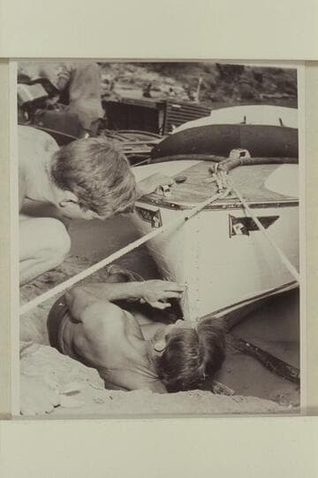 Daniels replacing the cutwater on the "Sweet Chariot" which had been ripped off when the craft hit the wall in Grapevine Rapid.  Cooper watches the operation.  Bright Angel Creek