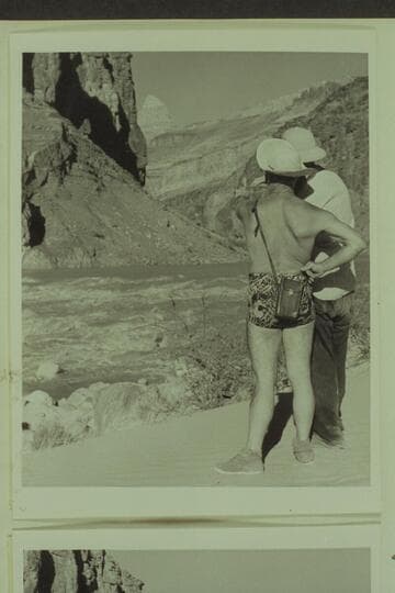 Hudson and Marston pose for the photographer to illustrate the business of studying a rapid before running it; Hance Rapid