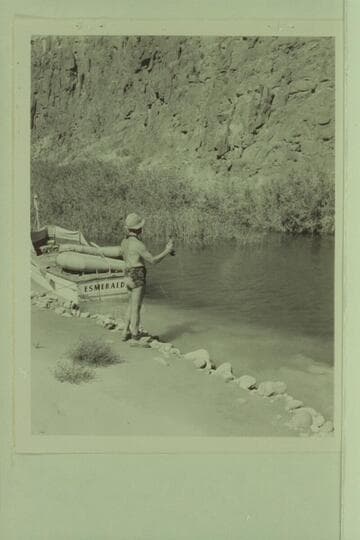 Marston fishing by the "Esmeralda" in lagoon at Tapeats Creek