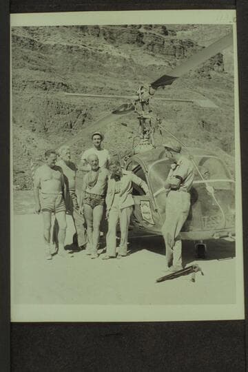 Helicopter and crew on beach at Tapeats Creek.  Left to right:  Taylor, Desloge, Marston, Forcier, Margaret Marston and Red Carson