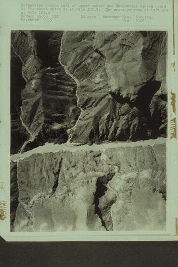 Serpentine Canyon left of upper center and Serpentine Canyon Rapid at its mouth which is at Mile 105.9.  The cross canyons at left are at Mile 105.6