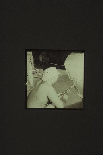 Bill belknap drills holes for the patching of the CACTUS at Tuna Creek Rapid, just above ESMERALDA BEND, Grand Canyon