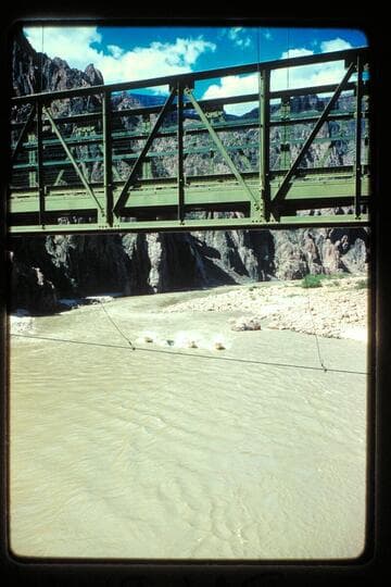 Four boats head up toward Bright Angel Bridge