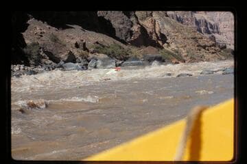 "Wee Red" climbs Vulcan Rapids