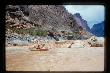 Belknap in Sportyak at foot of Vulcan Rapids