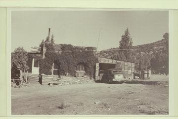 "The Lodge from south end.  Screened porch at left.  Living room center.  Garage right where the fire started in 1951"