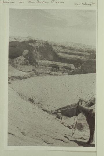 Dave Rust searching for route down into the Escalante River after his party had visited Hole-in-the-Rock