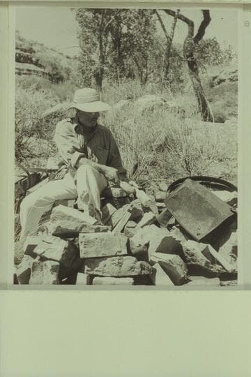 Marston examines the remnants of the old still in Lava Creek Canyon about two miles from the river