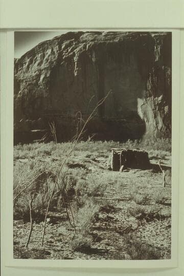 Framework of shade at lower left; summer hogan right center.  Mile 35.3, east side