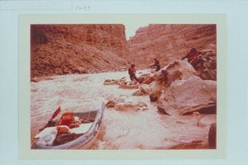 Buzz Belknap, Jorgen Visbak and Dock Marston line Dark Canyon Rapid