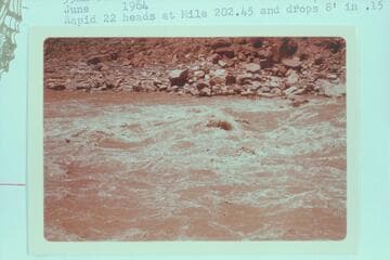 Lower end of Rapid 22 at Mile 203.30.  Rapid 22 heads at Mile 202.45 and drops 8 ft. in .15 miles