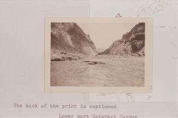 Upstream in Cataract Canyon from approximately Mile 201.9.  The rapid is #23 on the Chenowith-Hoyt list.  Photo sent by Adloph G. Sutro.  Back of print is captioned:  Lower part Cataract Canyon