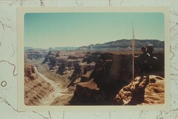 Hildreth posed on Esplanade below Enfilade Point.  Mouth of Forster Canyon at lower left