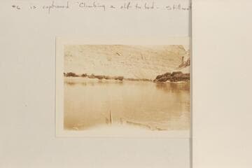 "Junction of the Green River and the Colorado."  Sent by Adolph G. Sutro.  It is captioned, "Climbing a cliff to bed--Stillwater Canyon."  The view is from Cataract Canyon back toward the junction and is similar to McCormick photo #15, 1901-1902