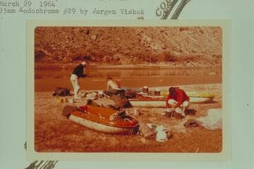 Packing at camp at Mile 212.8, left bank