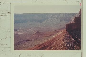 Across the toe of Stanton Point into Fossil Bay.  The route off the rim into Fossil Bay is over the talus on the right of center where the Coconino is covered