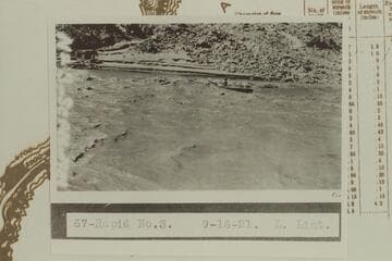 Ellsworth Kolb in U. S. Geological Survey skiff in Rapid #3.  Rapid #3 heads at Mile 211.65 and drops 4' in .15 miles