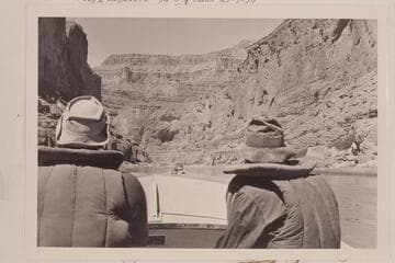 Bill Belknap, piloting, and Willie Taylor, riding, the "Cactus."  The "Bootoo" cruises ahead of them below Harding Rapid