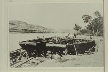 Hull of Hoskanini dredge under construction, Glen Canyon- Mile 121, Camp Stone