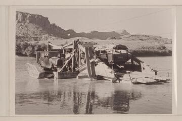 The Lincoln and Dodge Power Wagon on Chaffin Ferry in Hite, Utah