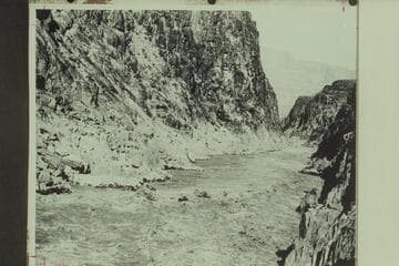 Elwyn Blake at the oars of the "Glen" in Separation Rapid.  The big wave to the left of the "Glen" is the one which capsized the "Grand."