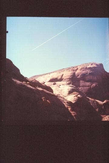 Ice trail of jet over Bridge Canyon