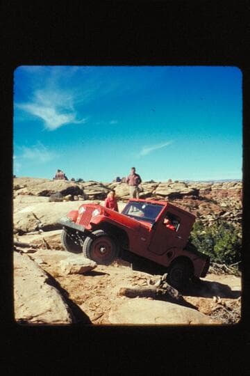 Kent watching Fern in jeep