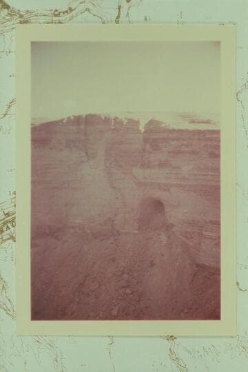 Cave in east wall of Hot Na Na Canyon