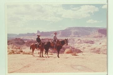 Dan Lehi and Tom Daly at rim of Mesa north of Anasazi Canyon at upper end of drainage which drops into Glen Canyon at Mile 74