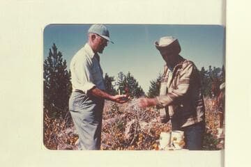 Marston gets some canned fruit from Daly.  Lunch on top of Navajo Mountain