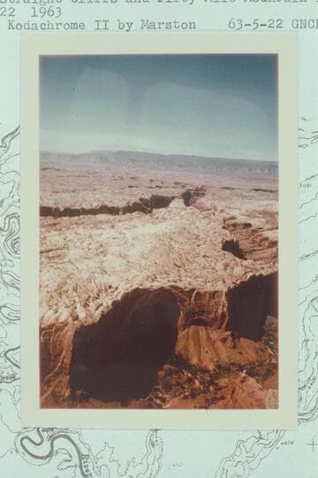 Down Cow Canyon to the Escalante River.  The Straight Cliffs and Fifty Mile Mountain in the distance