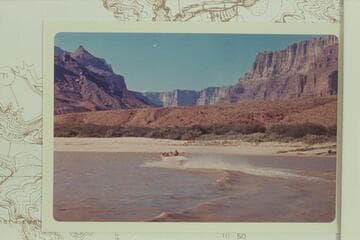 The "Kiwi" cruising up river at Mile 68.3.  Dock Marston rides at left, Jim Bechtel is center, Jon Hamilton at the wheel, Temple Butte is upper left and Espejo Butte is upper right