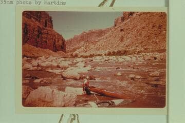 Les Jones and the kayak and boat at Badger Creek Rapid